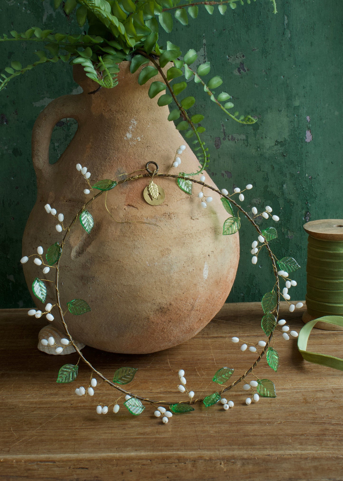 Wreath green leaves and white beads