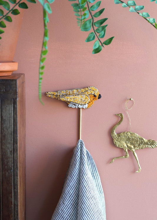 Vogelhaken mit Perlen