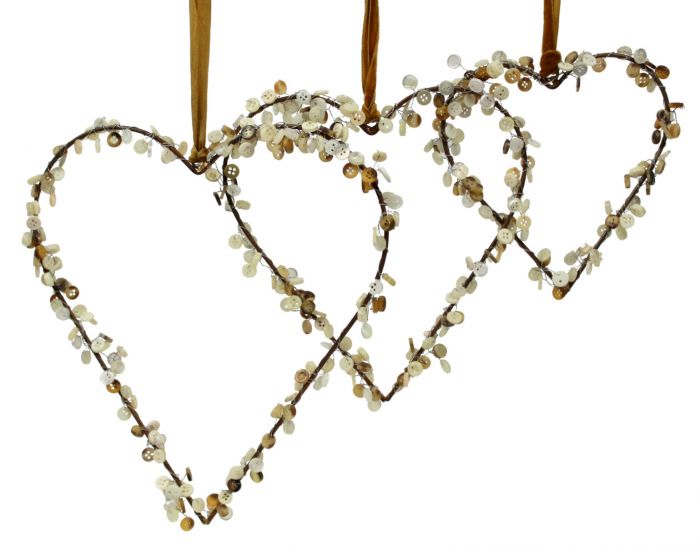 Three heart-shaped decorations made from buttons.
