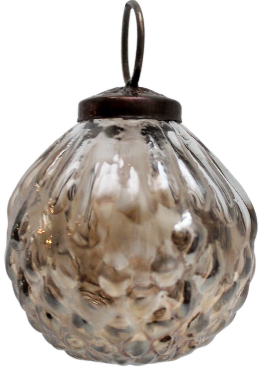 Decorative glass hanging ornament with textured surface on a white background