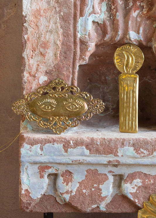 Decorative gold elements on a textured stone surface