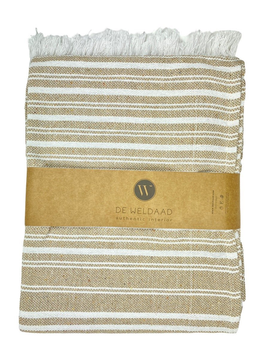 Striped towel with a brand label on a white background
