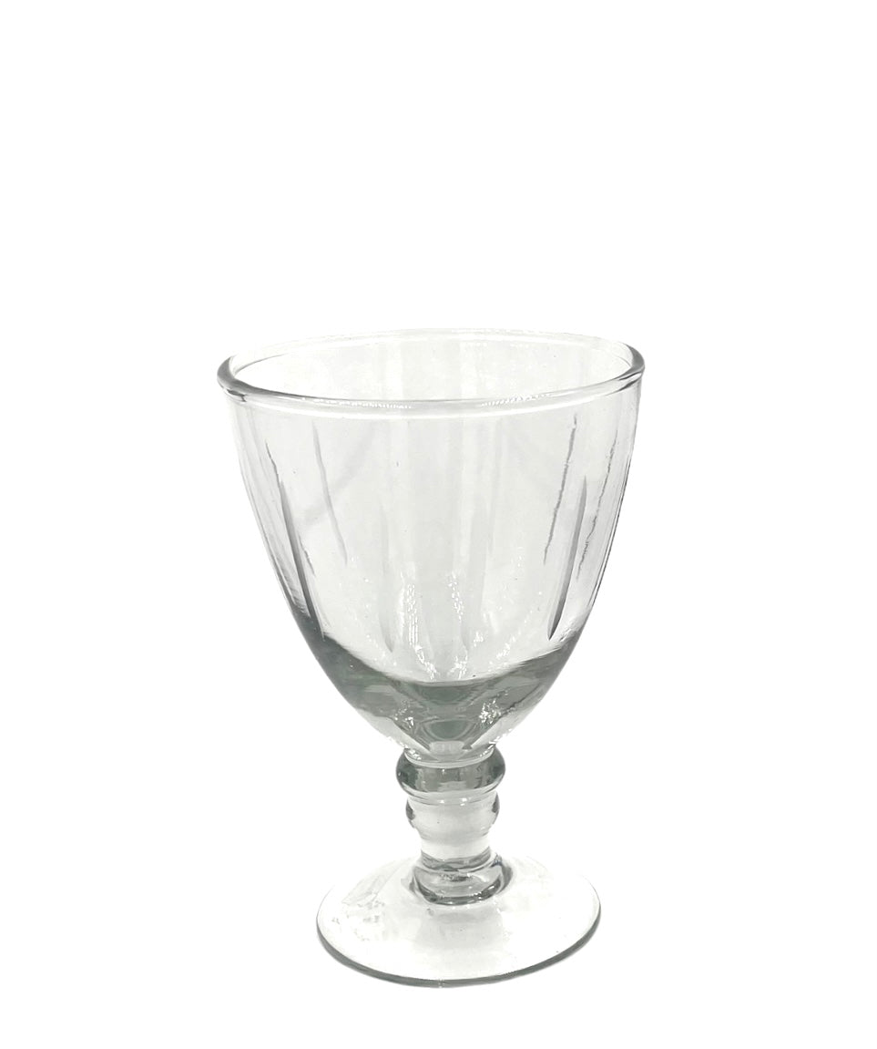 Transparent wineglass on a white background