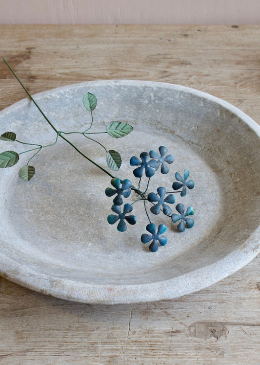 Handmade blue wire flower branch with leaves. Delicate decorative accent crafted with traditional South Indian wirework.