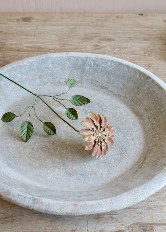 Handmade dusty rose metal flower with green leaves on a wire stem