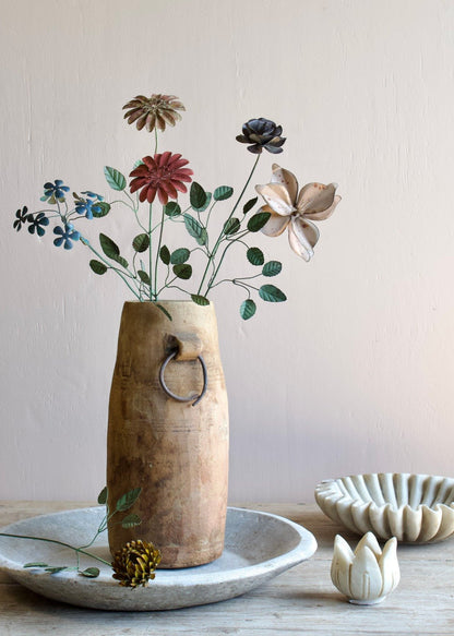 Wooden vase with flowers on a neutral background