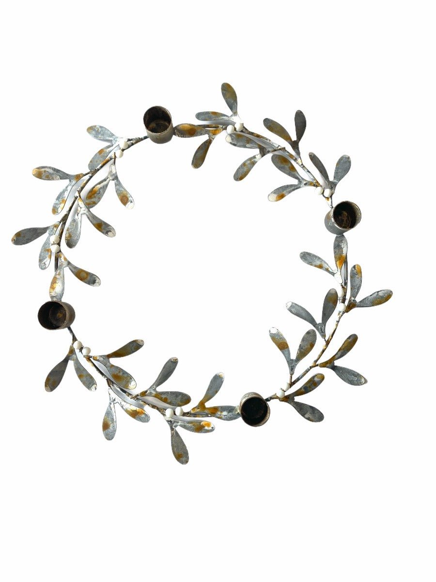 Decorative wreath with leaves and berries on a white background