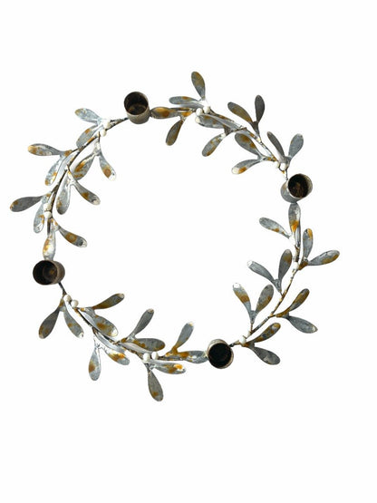 Decorative wreath with leaves and berries on a white background