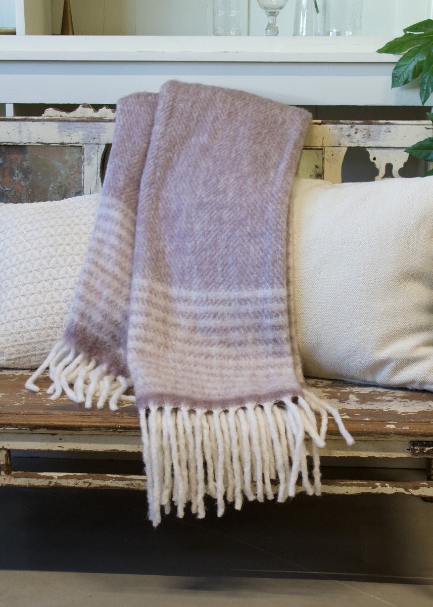purple plaid on a white wooden chair with decorative white cushions