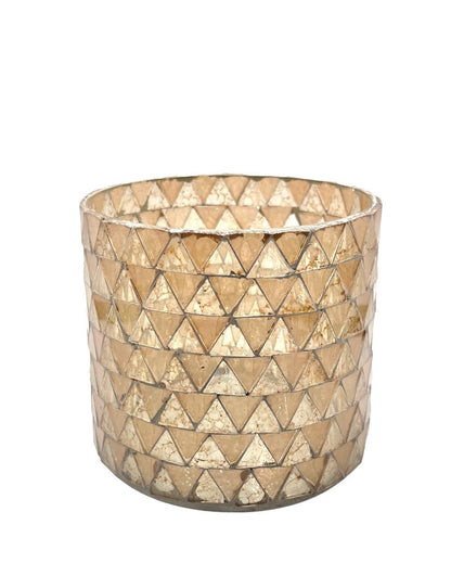 Decorative glass container with triangular pattern on a white background